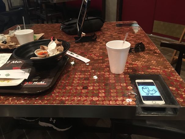 This Restaurant Has Receptacles In The Table So You Won't Spill On Your Phone