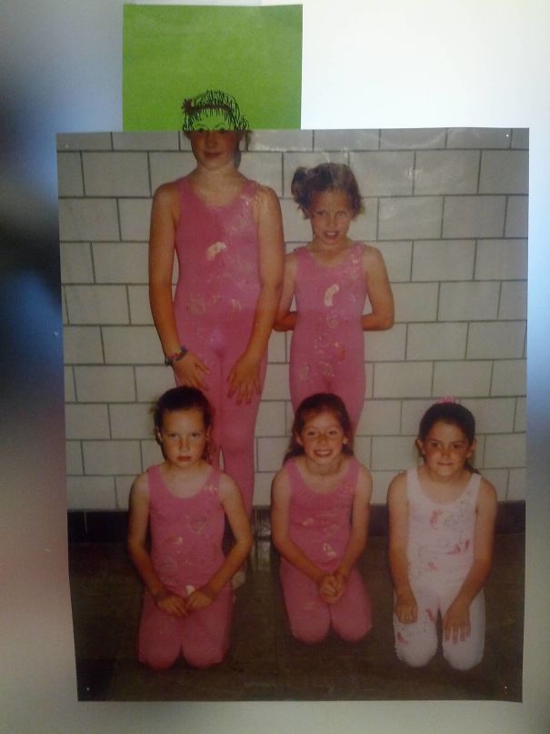 Group of children in pink outfits posing indoors showing height differences, illustrating tall people everyday struggles visually.