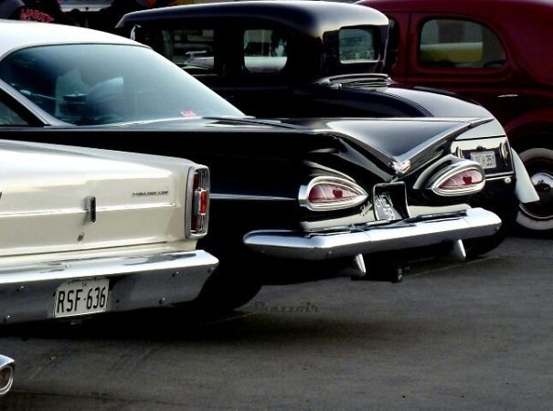 Rear view of classic cars with taillights resembling eyes, showcasing funny examples of pareidolia in everyday objects.