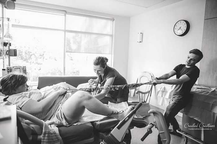 A Very Cool Photo Of A Woman Pulling While She Pushes