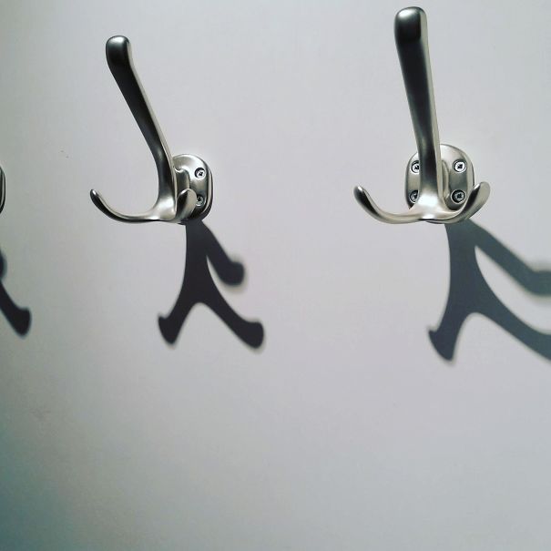 These Alarmed Coat Hooks Are Missing An Arm.