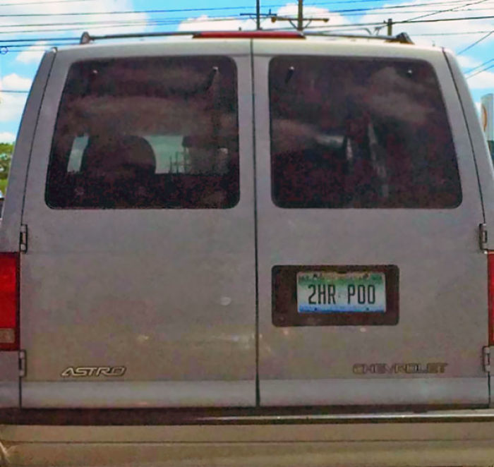 Chevrolet Astro van with a humorous license plate "2HR P*O," showcasing funny wives' humor.