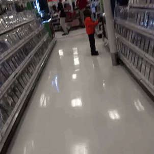 Two kids standing at video game store wearing same clothes