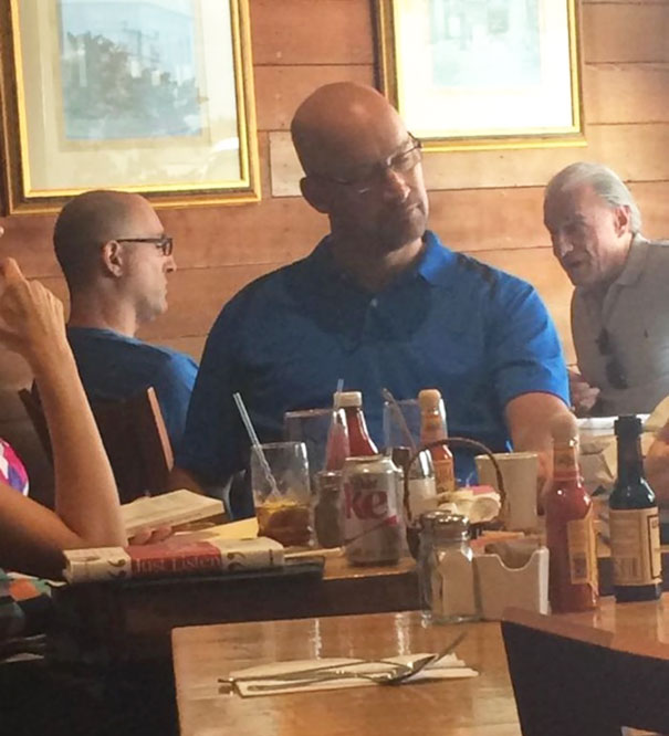 Person sitting and wearing blue shirts and looking similar