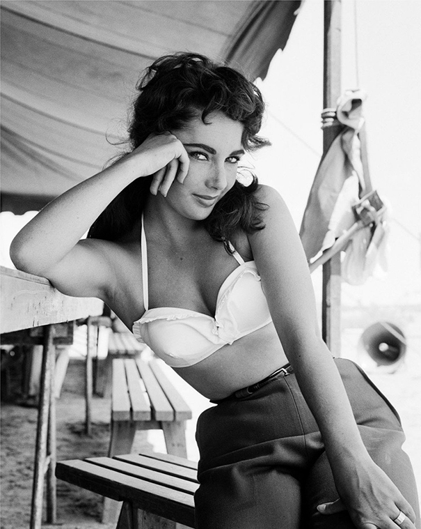 Vintage black and white photo of a woman in a white bikini top, illustrating the changing shape of the perfect female body.