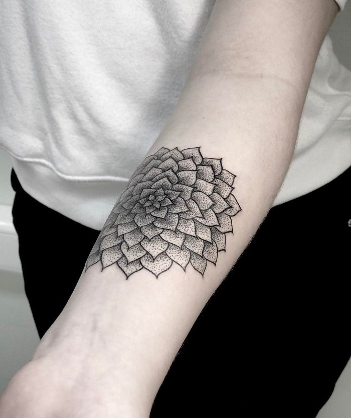 Detailed black succulent tattoo on a forearm, showcasing intricate design for succulent enthusiasts.