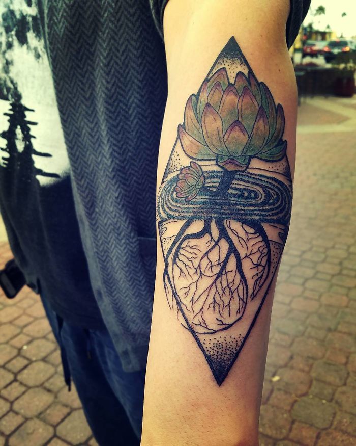 Succulent tattoo design on a person's arm, featuring a detailed geometric pattern.