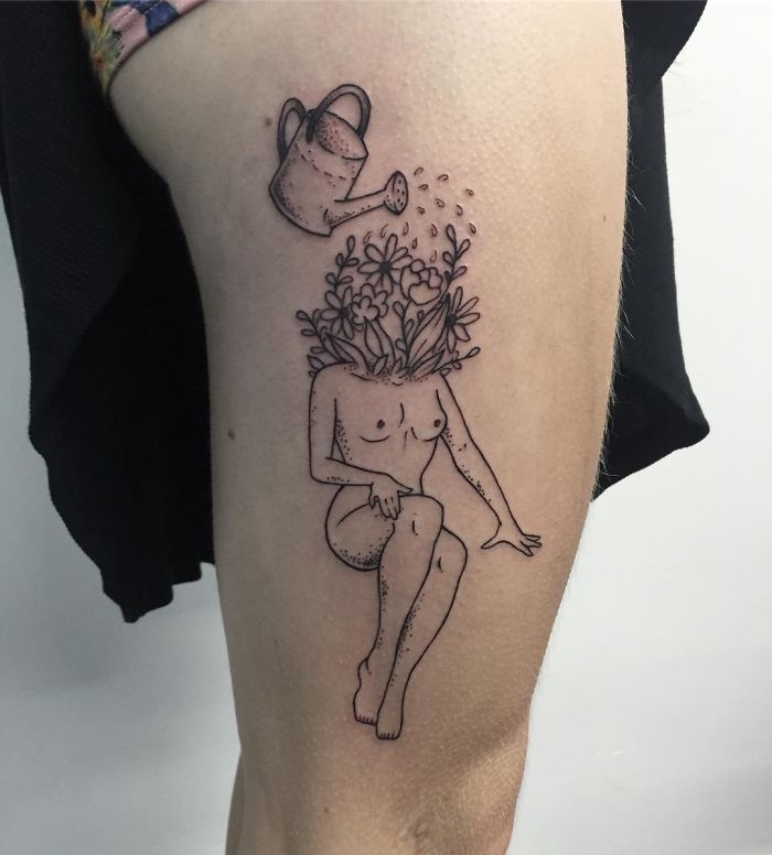Tattoo of a headless girl with flowers and a watering can, designed by Molly Jean, on someone's leg.