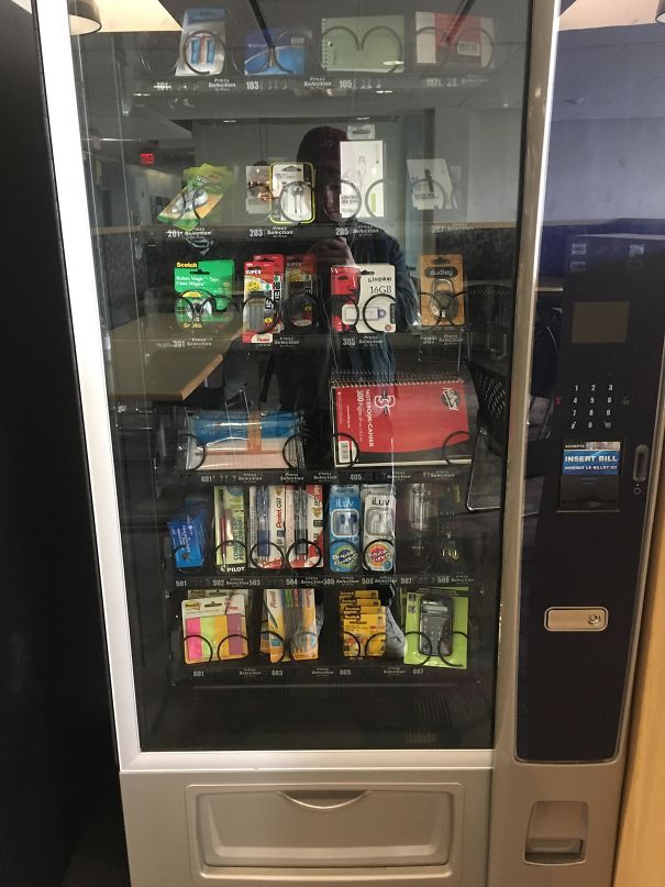 School genius idea: vending machine stocked with school supplies like notebooks, pens, and USB drives in a hallway.
