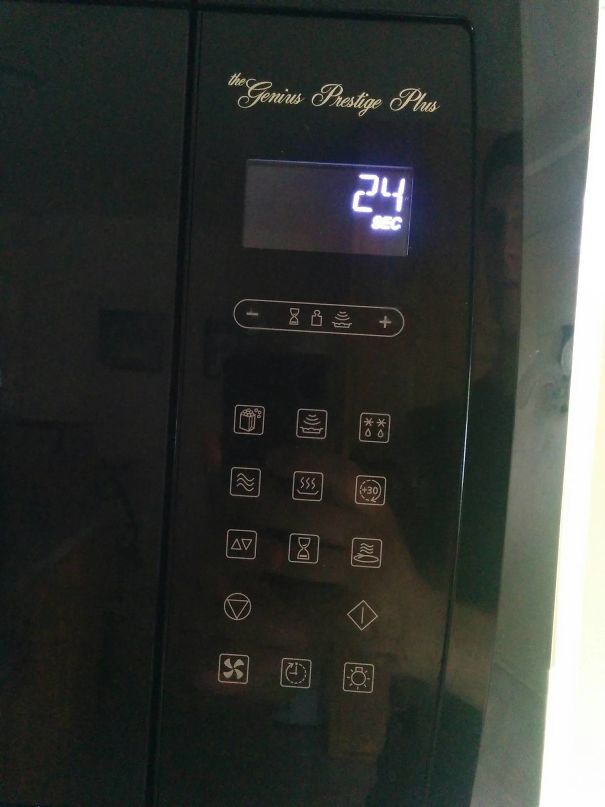 Microwave with unclear buttons, digital display shows "24 SEC", a funny design fail.