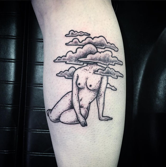 Tattoo of a headless girl with clouds by tattoo artist Molly Jean.