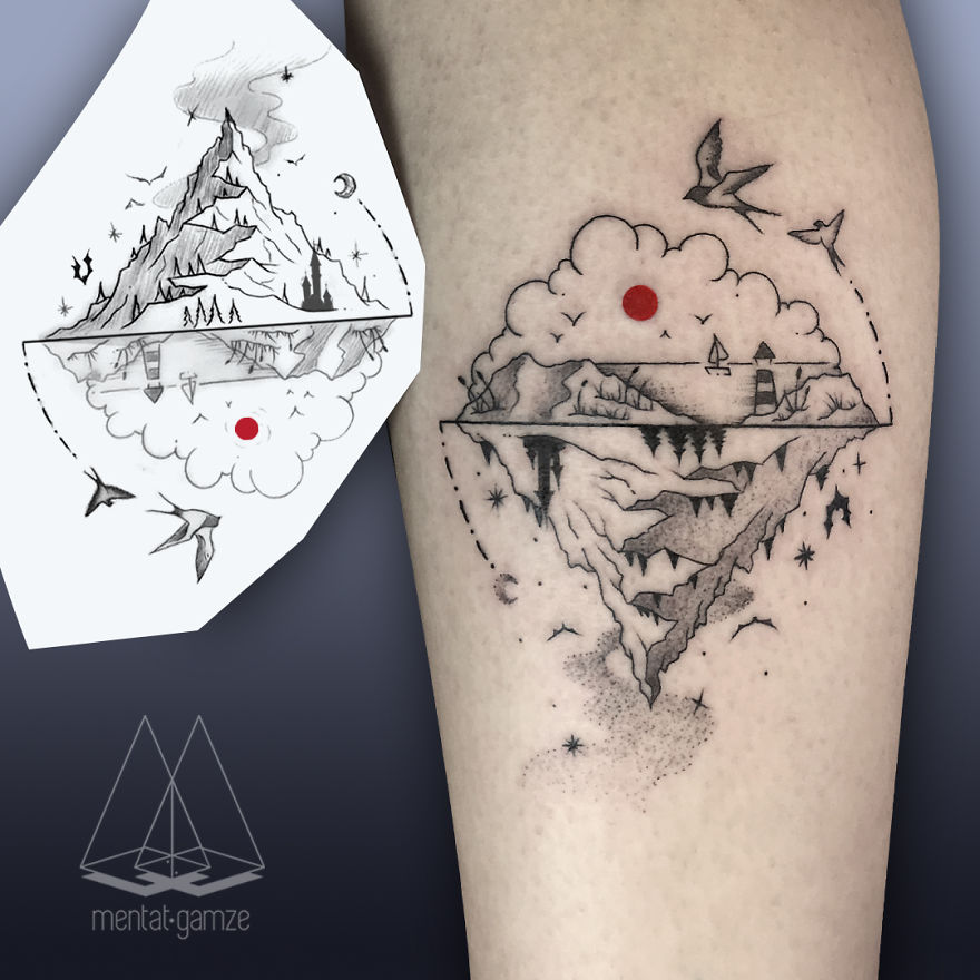 Tattoo art featuring a mountain scene with a red dot and birds, showcasing a unique tattoo design.