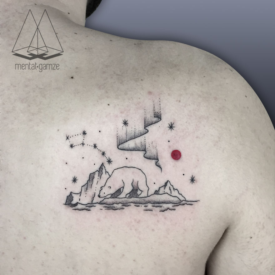 Tattoo of polar bear and stars with a red dot on person's back, showcasing tattoo artistry.