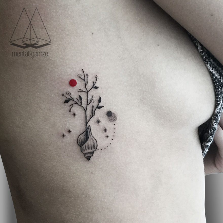 Tattoo of a seashell and branches with a red dot, symbolizing a creative journey from a boring job to tattoo artistry.