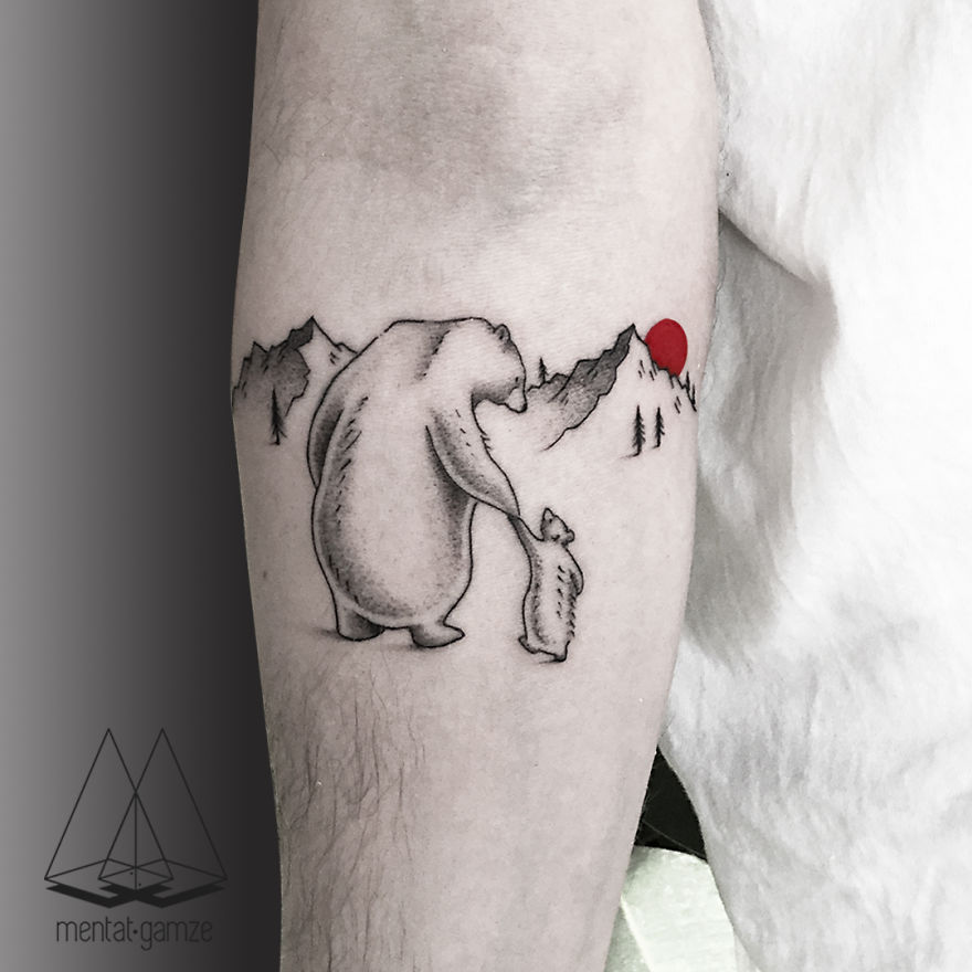 Bear and cub tattoo with mountains and red dot, showcasing the result of switching to a tattoo artist career.
