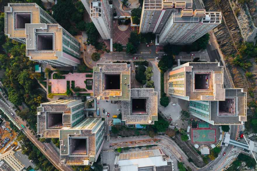 Aerial view of high-density residential buildings in Hong Kong illustrating claustrophobic living conditions.