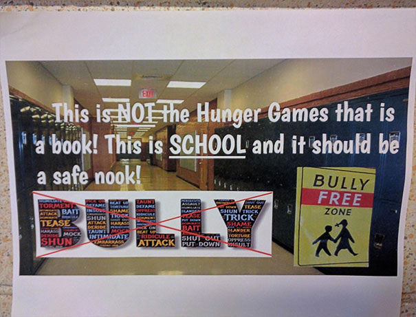 Anti-bullying poster with humorous message in a school hallway, part of funniest design fails.
