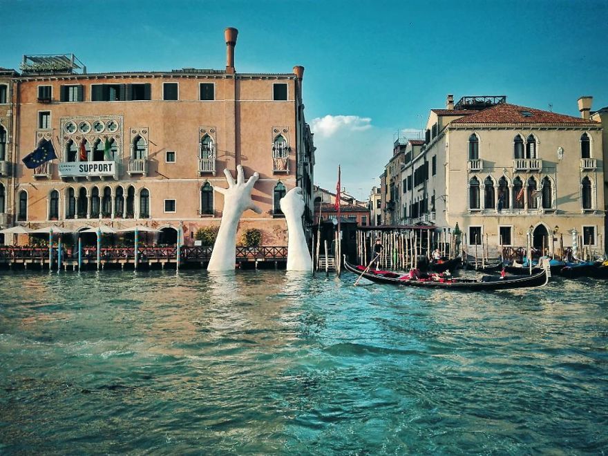 Support: Giant Hands Rise From A Canal In Venice To Send A Powerful Message About Climate Change Support: Giant Hands Rise From A Canal In Venice To Send A Powerful Message About Climate Change