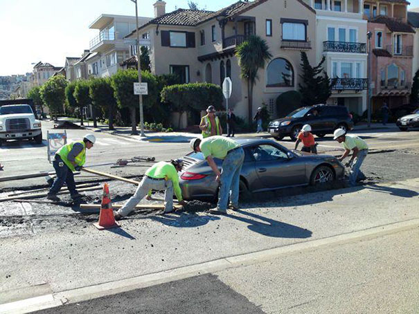Dude Tries To Get Around A Line Of Stopped Cars And Drives Right Into Fresh Cement