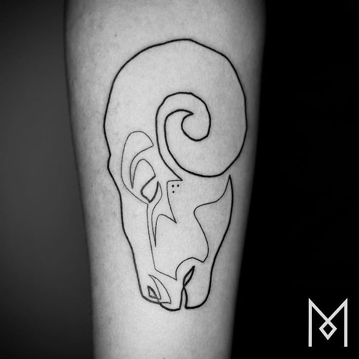 Single line ram tattoo by Mo Ganji on forearm, showcasing minimalist design.