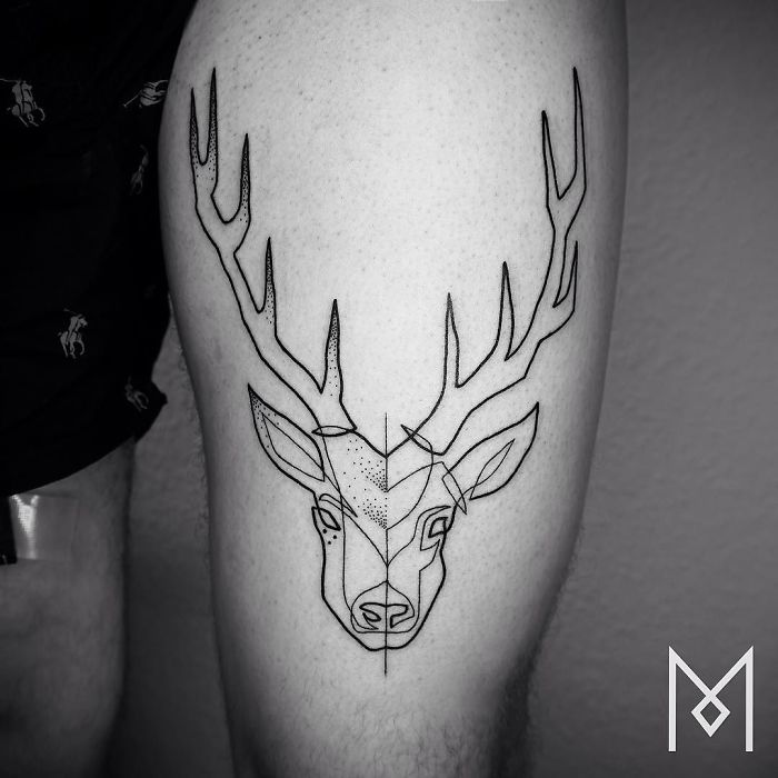 Single line tattoo of a stag head by artist Mo Ganji, showcasing intricate geometric design on a person's thigh.