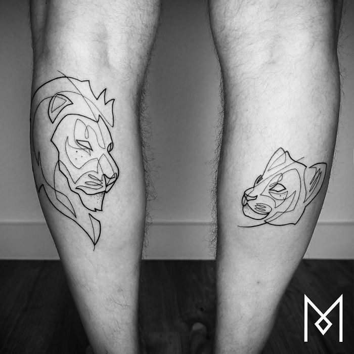 Single continuous line tattoos of lions by Mo Ganji on legs.