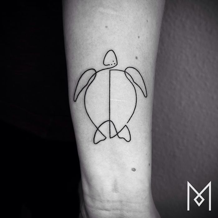 Single continuous line turtle tattoo by Mo Ganji on an arm.