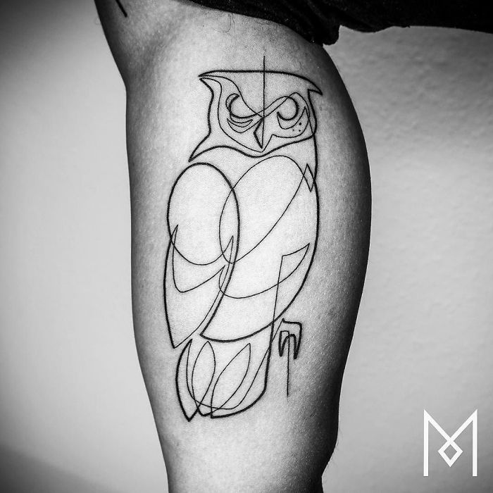 Single line tattoo of an owl on skin, created by Mo Ganji.