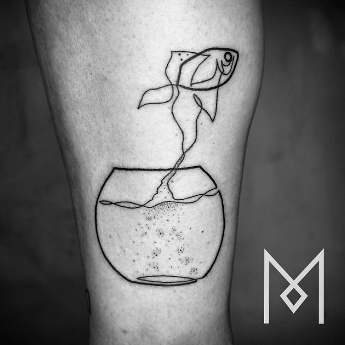 Single-line tattoo by Mo Ganji depicting a fish and a rose in a bowl.