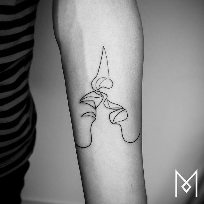 Single line tattoo design by Mo Ganji, featuring abstract geometric shapes on an arm.