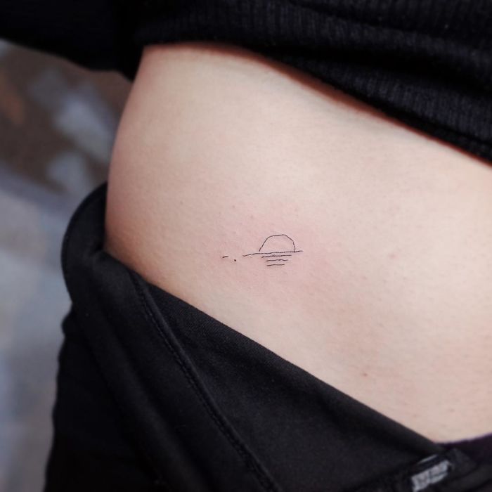 Minimalism tattoo of a sunset on the side of a person's torso.