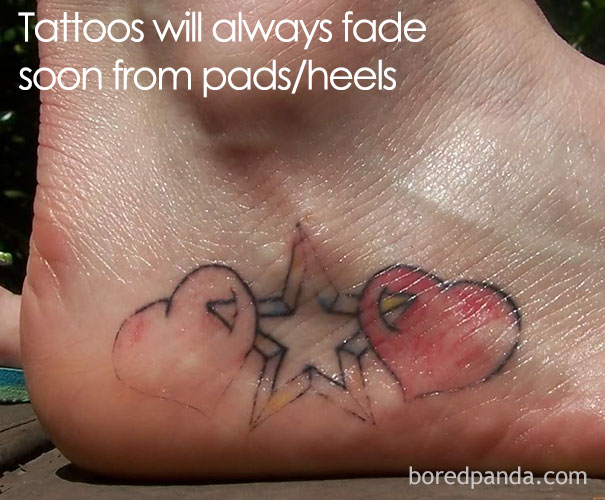 Tattoos on heel with hearts and star design, showing how tattoos age and fade over time.