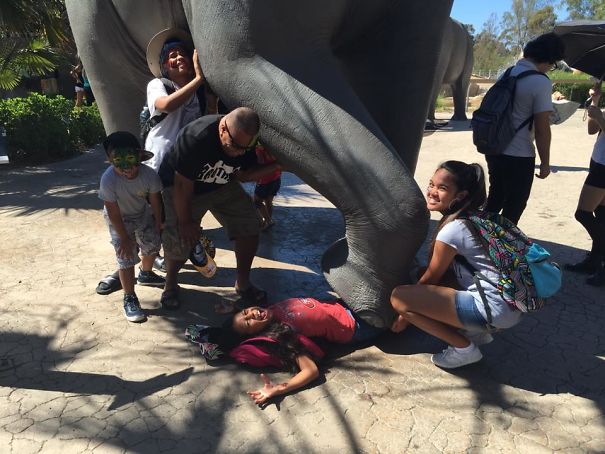 People Playing With Statues