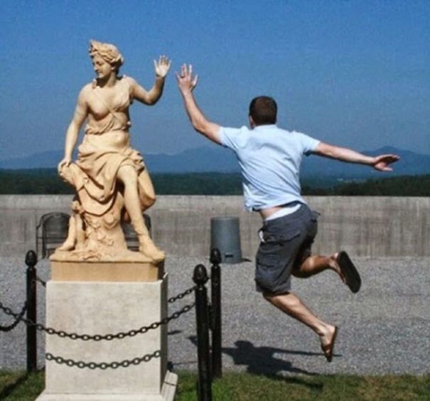 People Playing With Statues