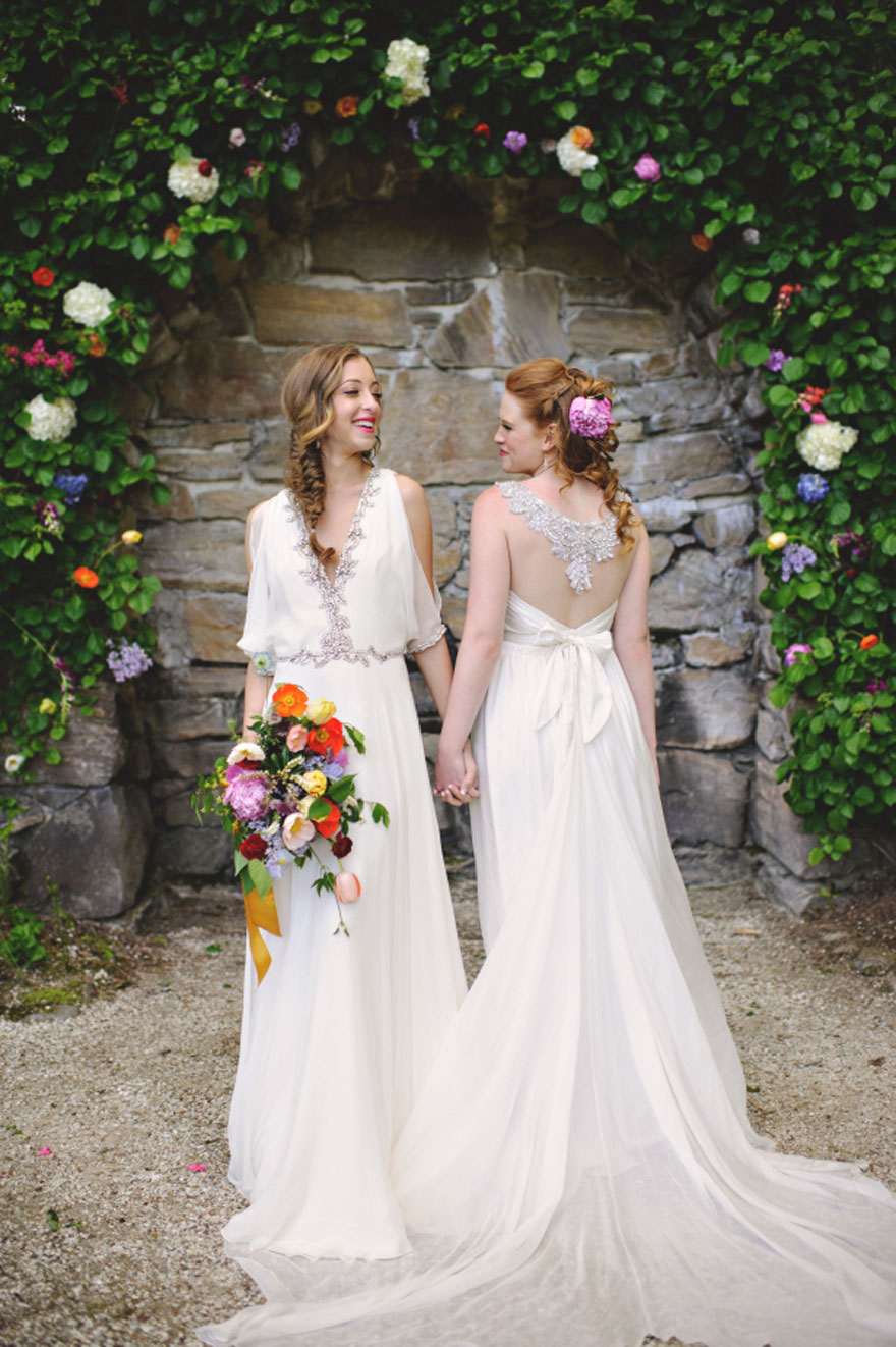 Two happy woman holding hands 