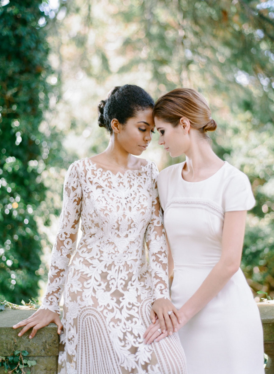 Two woman holding hands and looking each other into the eyes 