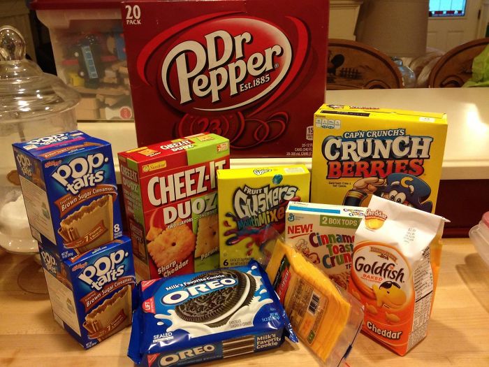 Snacks and drinks including Dr Pepper, Pop-Tarts, Oreos, and Goldfish highlighting the fun side of married life.