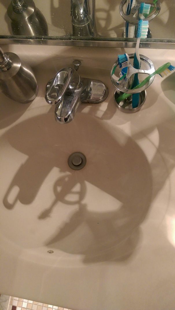 The Shadow From My Toothbrush Holder Looks Like The Avengers Logo