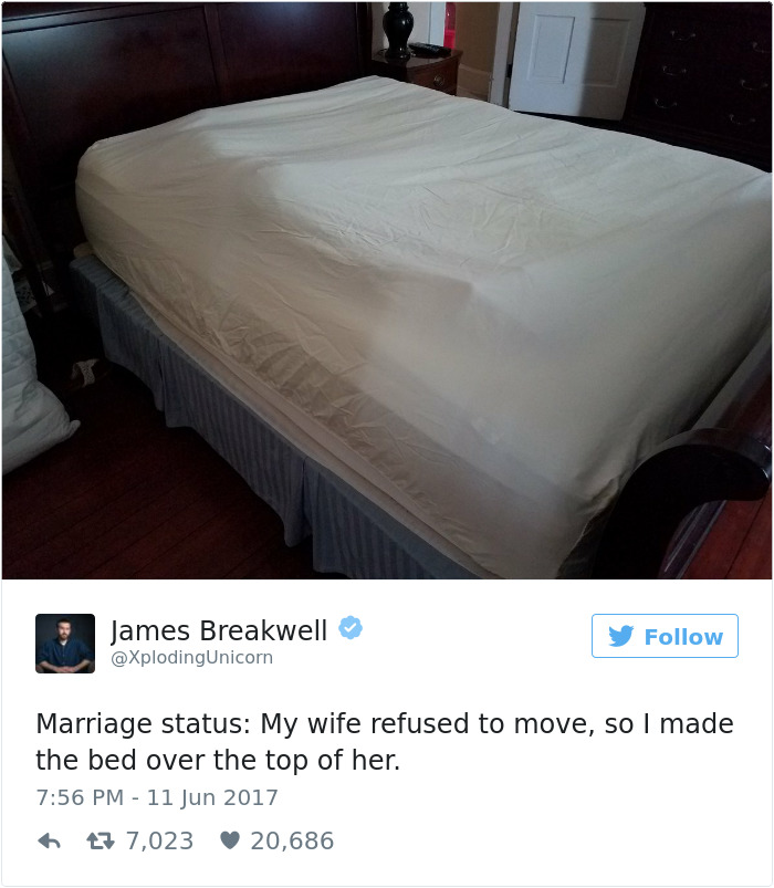 A bed made with a humorous bump, showcasing a funny take on married life.