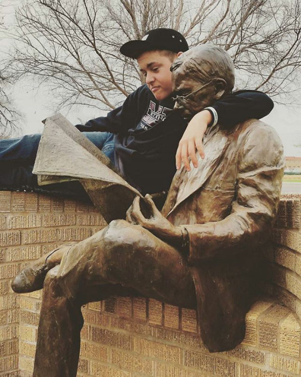 People Playing With Statues