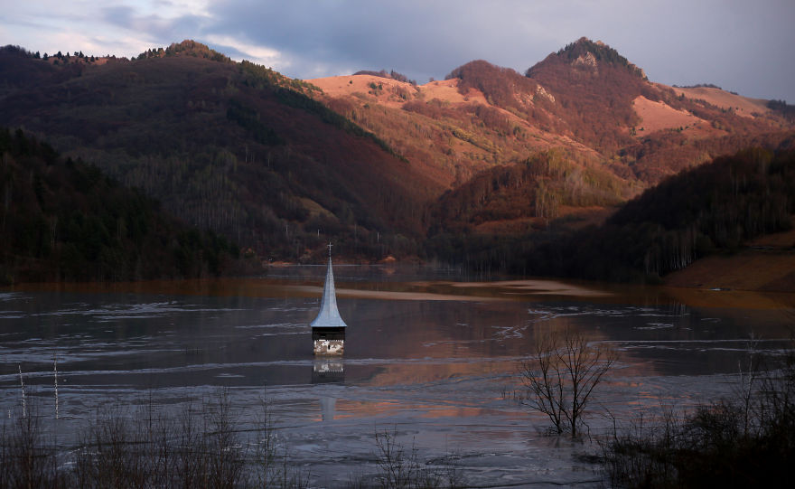 This Church Spire Is All That Remains Of A Village, Soon It Will Be Buried Completely This Church Spire Is All That Remains Of A Village, Soon It Will Be Buried Completely