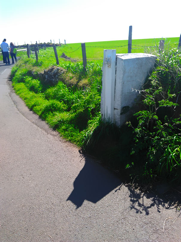 The Shadow From This Gate Post Looks Like Batman