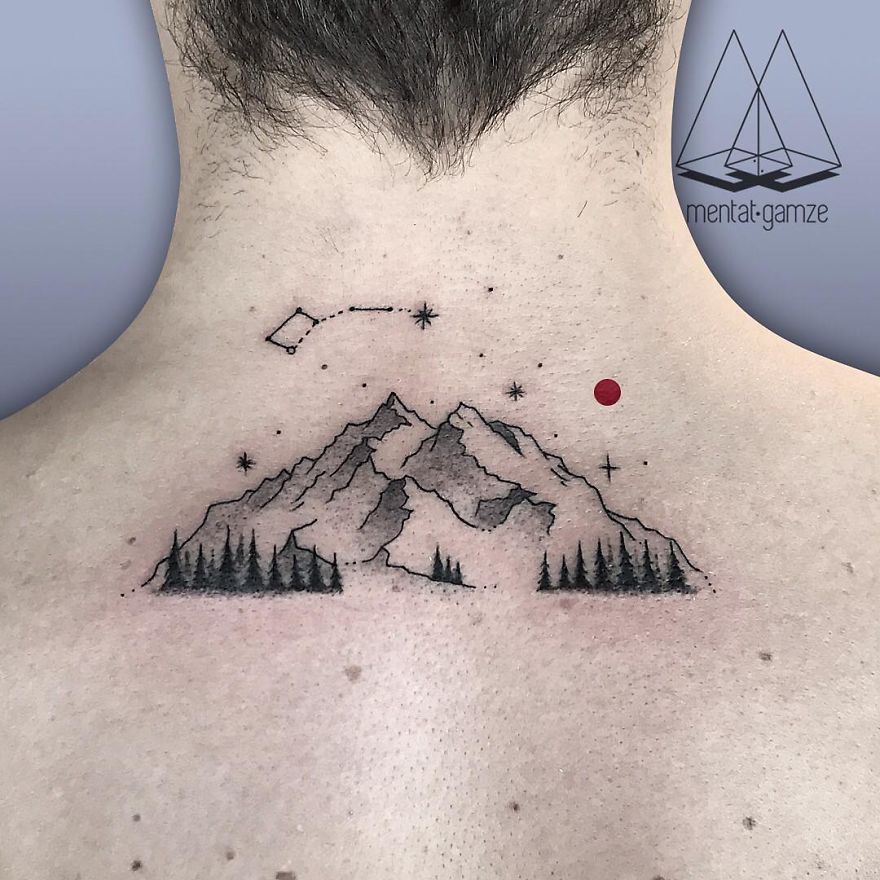 Tattoo of mountains and trees with a red dot and constellations on the back of a neck.