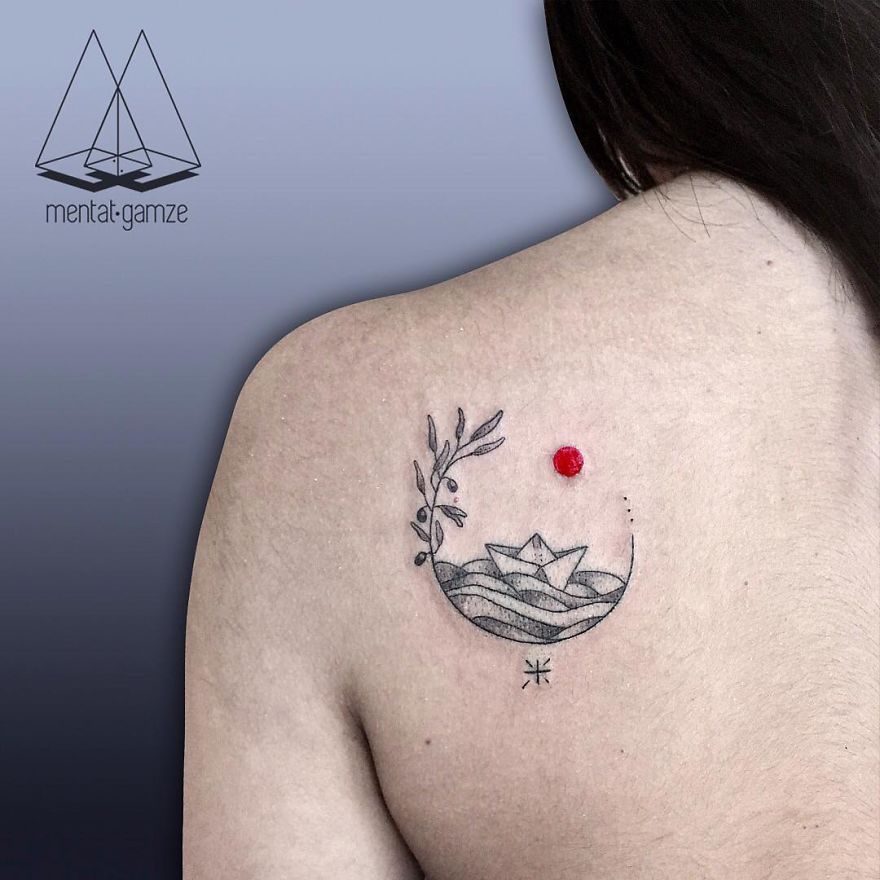 Tattoo of a red dot and abstract design on a shoulder, representing a journey from a boring job to tattoo artistry.