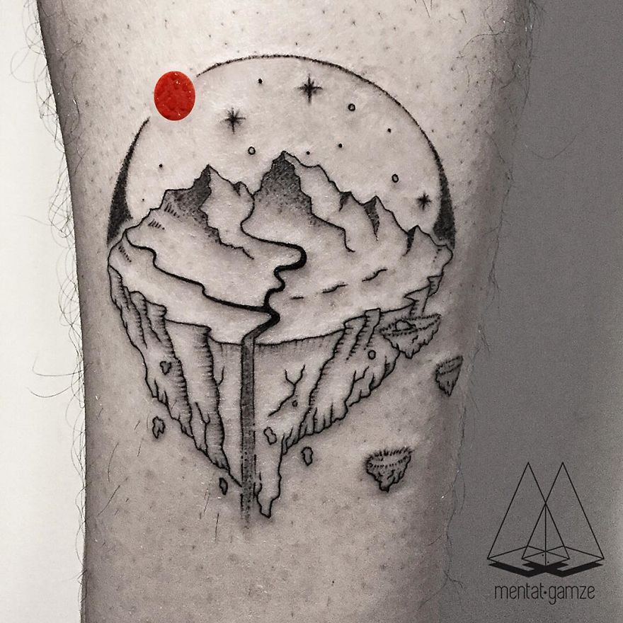 Floating landscape tattoo with mountains, featuring a red dot at the top left, created by a tattoo artist.