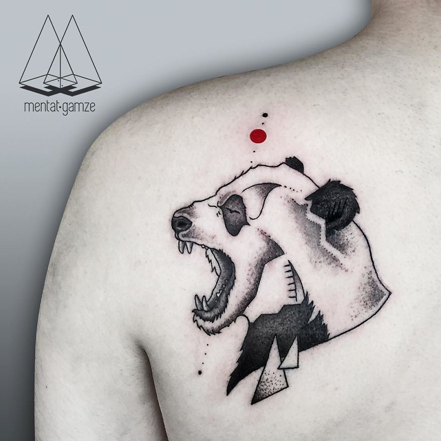 Bear head tattoo with geometric design and a red dot above on shoulder, representing a tattoo artist's journey.