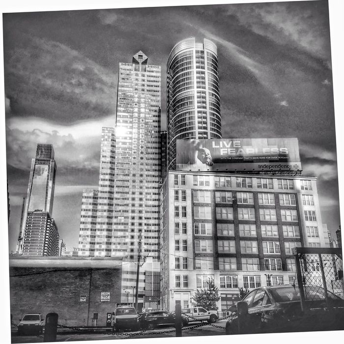 Traces Of 19th & 20th Century Buildings Stand In Front Of Dramatic New Buildings.