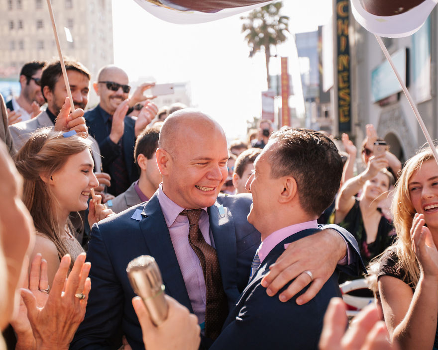 Two happy men hugging 