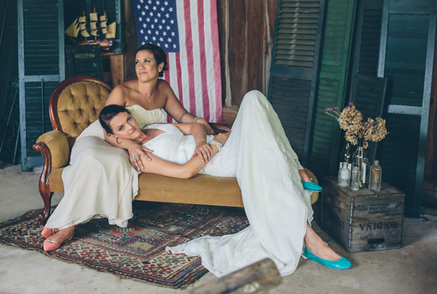 Two women in dresses posing for a picture 