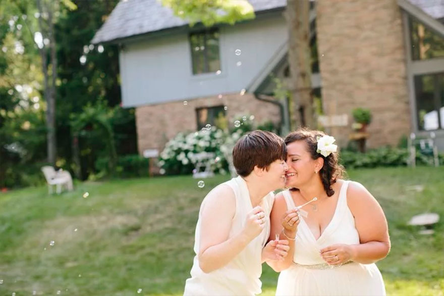 Two happy women kissing 